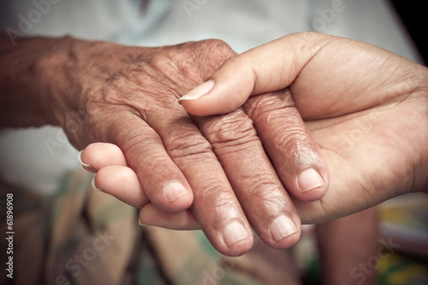 Obraz Senior and young holding hands