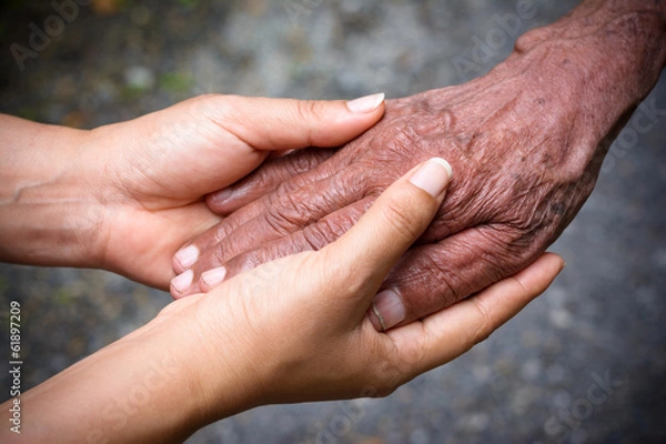 Obraz Senior and young holding hands