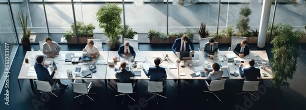 Fototapeta Top view of business people working in office