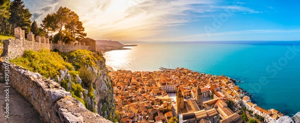 Fototapeta Aerial view of Cefalu at sunset. Medieval town on Sicily island, Italy. Seashore village with sandy beach, sea, historic buildings and mountains. Popular tourist attraction in Province of Palermo