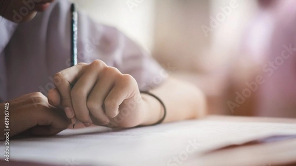 Fototapeta The students were doing the exams inside the classroom with stress.Assessment examination of high school students