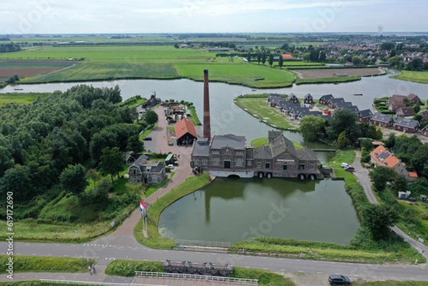 Obraz Drone photo of The Four Noorder Koggen steam pumping station, the first part of which was completed in 1869, is located on the IJsselmeer near the city of Medemblik in North Holland.