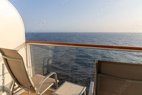 Obraz Cruise ship balcony with a chair and a table.