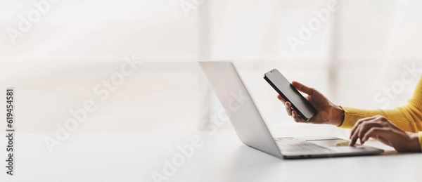 Fototapeta Type search information from the Internet network. Businessman working with smartphone, tablet and laptop computer on table in office. network concept