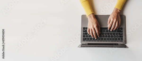 Fototapeta Close-up portrait typing keyboard on laptop computer. Working online on white table at office. Facebook chat. Website meeting. Blogger. Journalist writing articles. online job ideas