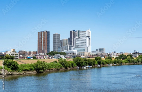 Fototapeta 多摩川沿いの高層ビルの風景