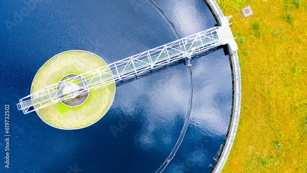 Fototapeta Sewage treatment plant from above. Grey water recycling. Waste management theme. Ecology and environment in European Union.