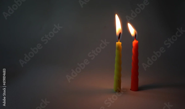 Fototapeta two color candles burning