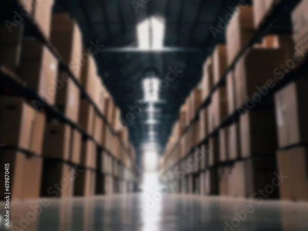 Fototapeta Blurred  A warehouse where the goods are packed in a large number of brown cardboard boxes.