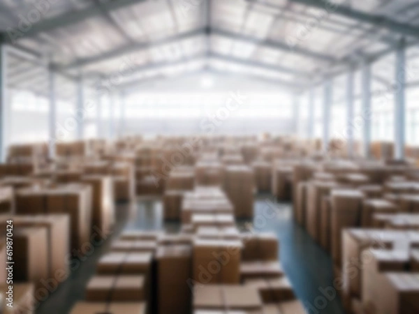 Fototapeta Blurred  A warehouse where the goods are packed in a large number of brown cardboard boxes.