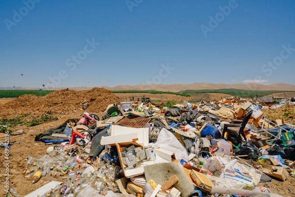 Fototapeta Trash dump or landfill in Santa Maria, California. Environmental problems, pollution, waste or trash from household concept