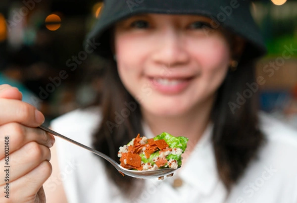 Obraz Asia woman eating salad for diet