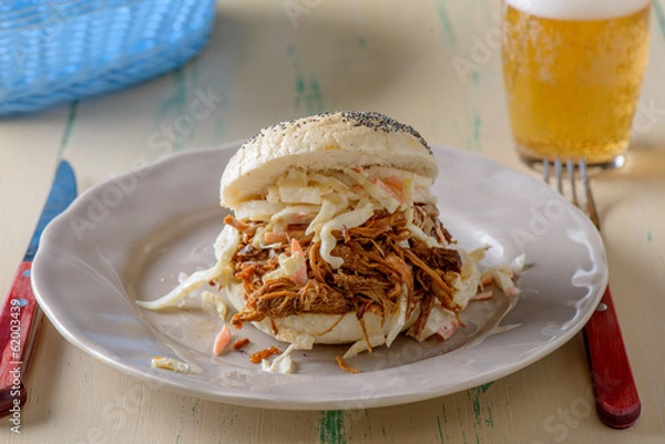 Obraz Pulled pork in a bun with a beer on the side