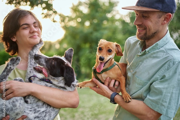 Obraz Support, care or happy family, men and kids bonding with foster puppy or pet and enjoying time together. High quality photo