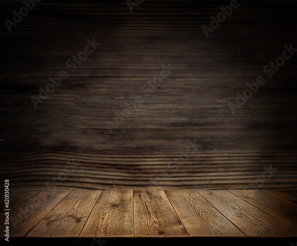 Fototapeta  An empty wooden countertop against a black, dark concrete wall. Home interior. Evening, dim light. Space for text. Copy space
