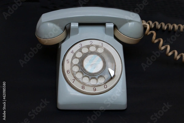 Obraz old telephone on black background