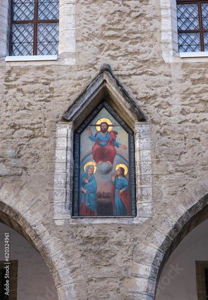 Fototapeta Fragment of the wall of the old city hall. Tallinn, Estonia. Painting - Judgment Day - in a niche above the fifth pylon of the arcade of the town hall