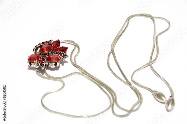 Fototapeta silver pendant with ruby on isolated background