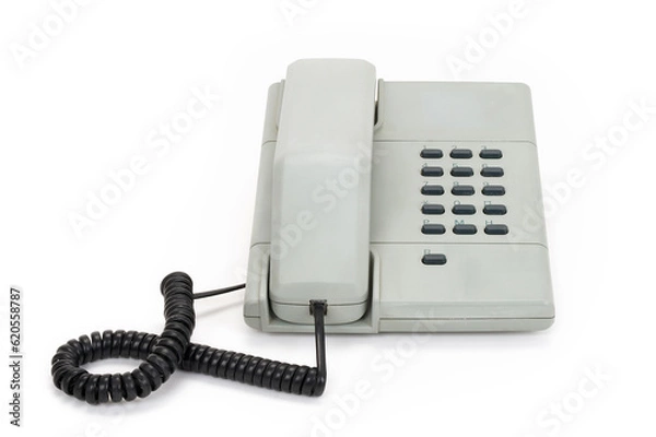 Fototapeta Front view of a grey vintage telephone from the eighties isolated on completely white background