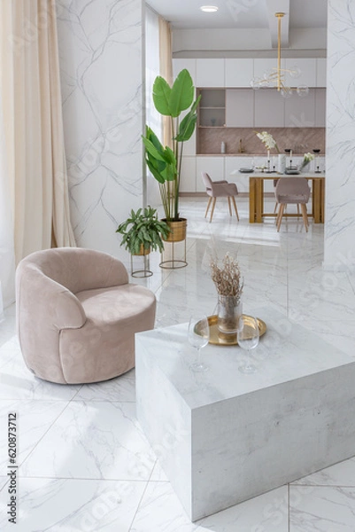 Obraz light luxury interior design of a modern apartment in a minimalist style with marble trim and huge windows. daylight inside the kitchen and living room