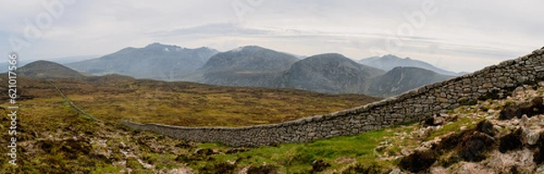 Fototapeta Panoramic view of typical Irish landscape, fields, sea in background. Picture taken from the top of Mourne mountains