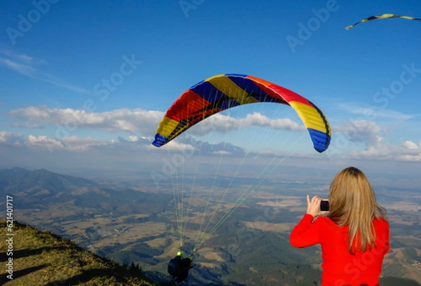 Obraz colored Paraglider taking off from Pico Agudo in Santo Antonio do Pinhal, SP, Brazil