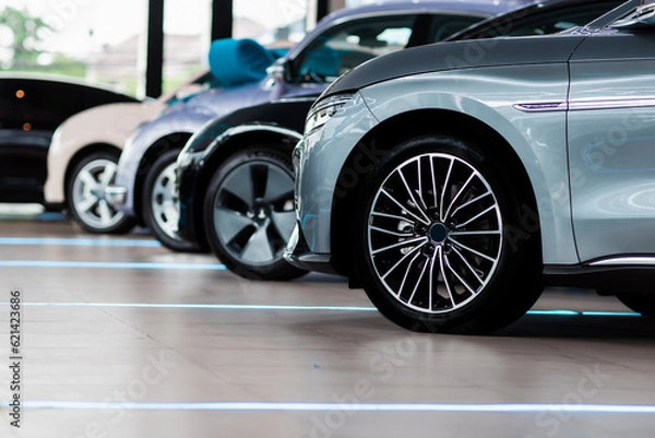 Obraz Beautiful Car dealership showroom interior with brand new vehicles for sale. White floor for new car parking,  showroom, park, show waiting for sales.