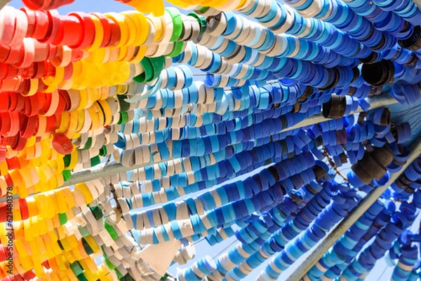 Fototapeta Colorful plastic bottle caps on sun umbrellas. Recycle, Reuse, Reduce waste. Zero waste