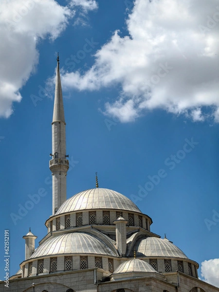 Fototapeta cloudy sky in the background and the mosque's domes and minaret