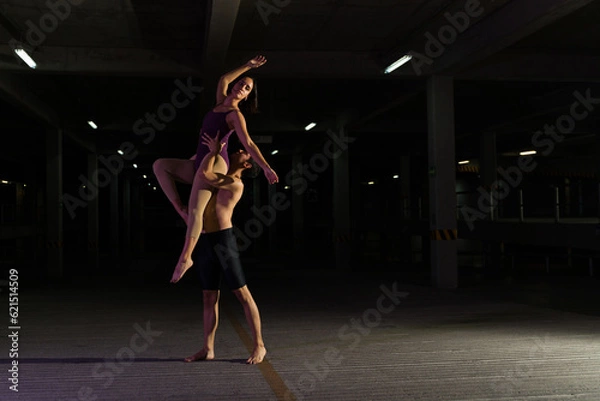 Fototapeta Urban performers doing a dramatic dance in the street