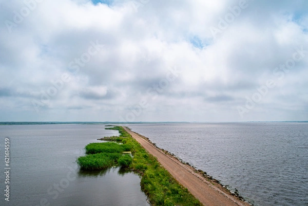 Obraz Horse Island Birdwatch Tower on the pier into the Liepaja lake in Liepaja, Latvia during sunny summer day