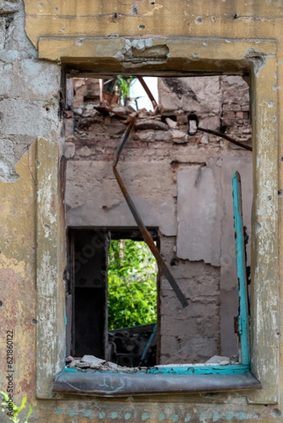 Fototapeta empty window of a destroyed house in Ukraine