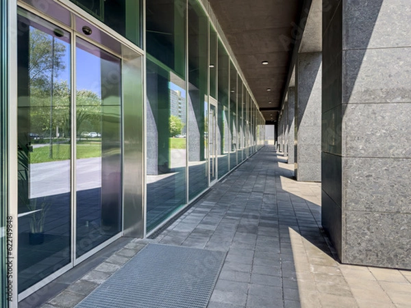 Fototapeta modern business building with glass facade. urban architecture.