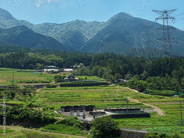 Obraz 青空の下に広がる山間部の棚田
