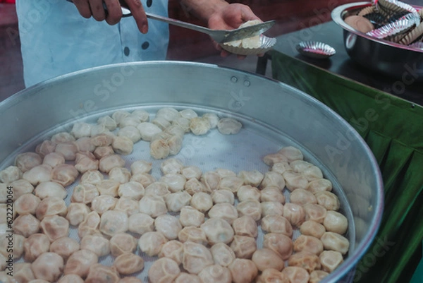 Obraz Nepalese steamed dumpling momo serving at the party. Close up image.