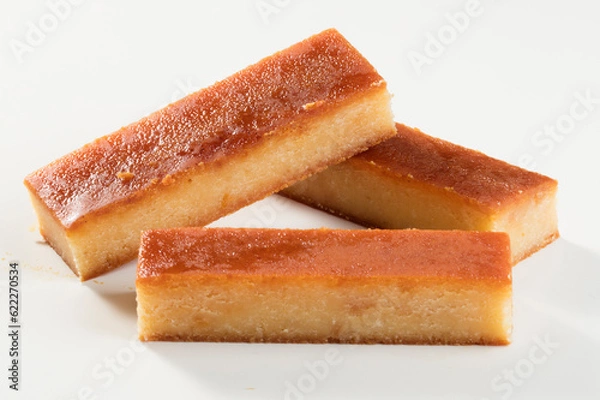 Fototapeta Turrón de yema cortado sobre fondo blanco. Yolk nougat cut out on white background.