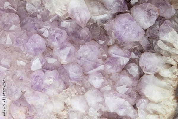 Fototapeta Close-up of natural violet amethyst druse geode mineral crystal unpolished semi-precious gemstone. Magic rock for ritual, witchcraft, spiritual practice, meditation. Esoteric life balance concept