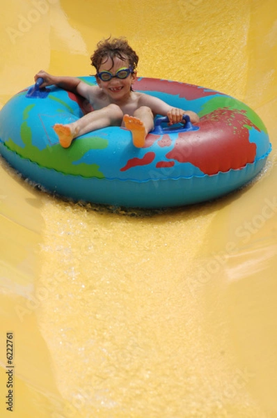 Obraz boy going down slide at waterpark