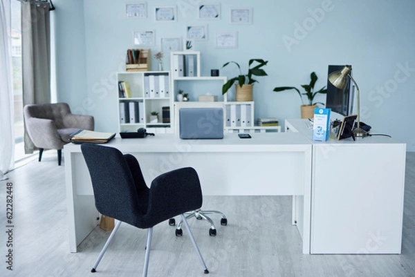 Obraz Empty, office of medical doctor and consultation with furniture, table or professional layout of hospital interior. Background, consulting room or workplace in healthcare, surgery and wellness clinic