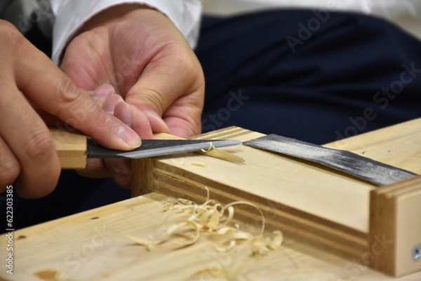 Fototapeta Japanese craftsman making a bamboo spatula, an important tool for working with Japanese lacquer urushi. Handmade arts and crafts.