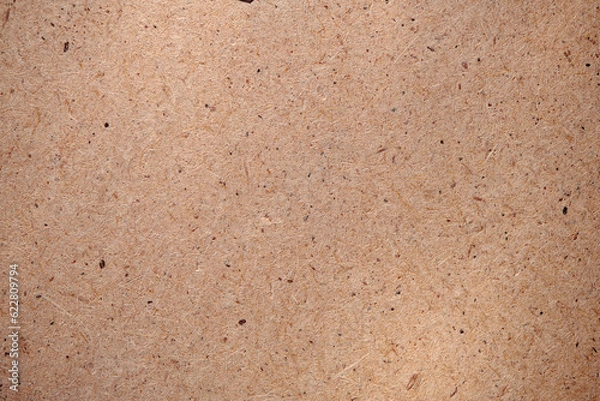 Fototapeta Hardboard surface for background or texture. Masonite Texture. Plywood hardboard background. Wooden board made of pressed sawdust. Top view.