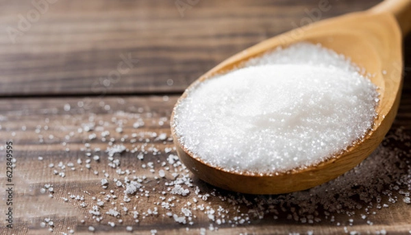 Obraz Sugar on wooden table. Selective focus