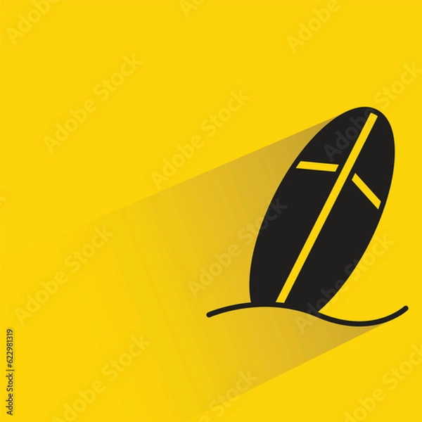 Fototapeta surfboard with shadow on yellow background