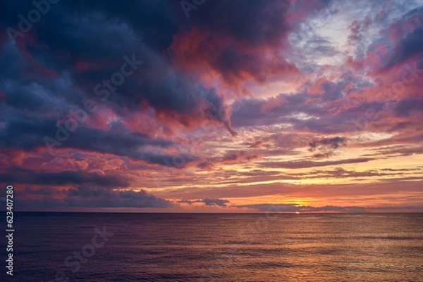 Obraz sunset with dramatic clouds over the sea