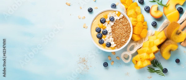 Fototapeta Quick and Healthy Breakfast Ingredients: Granola and Fruits on Blue Background. Top View, Flat Lay. Cooking Quick Healthy Breakfast Concept