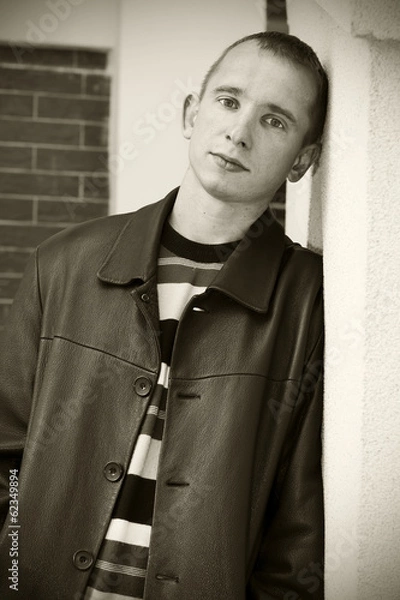 Fototapeta Young man looking attentively