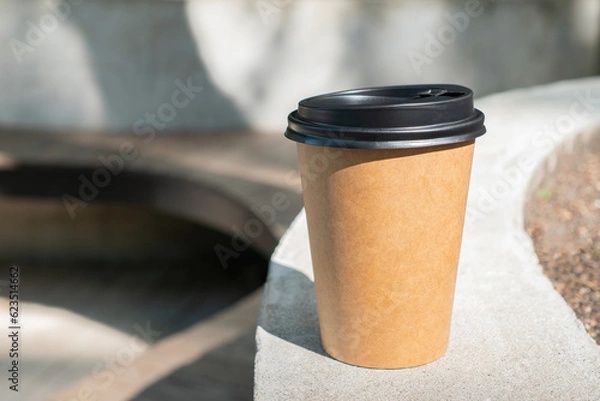 Obraz Coffee paper cup on the concrete fence mock up