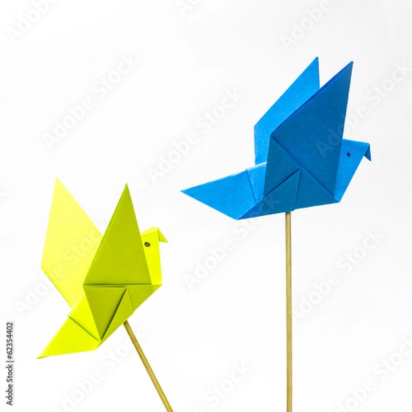 Fototapeta Origami bird with stick bottom it to look like it fly.