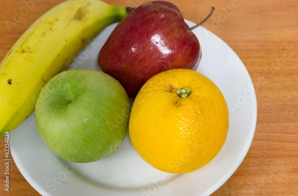 Obraz Healthy fruits like banana, oranges and apples