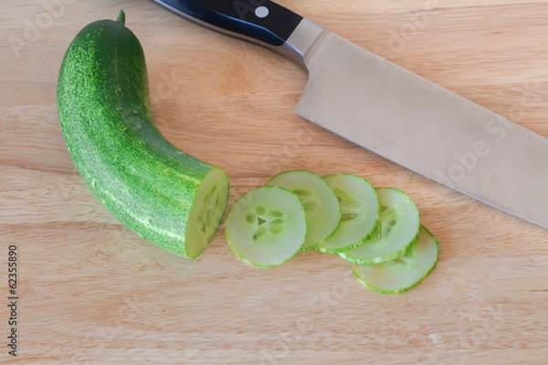 Obraz cucumber slices on wooden background